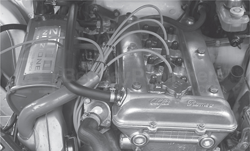 With the air-injection trunking removed, the view of the linkages of the SPICA injection system of this 1979 Sports Sedan is improved.