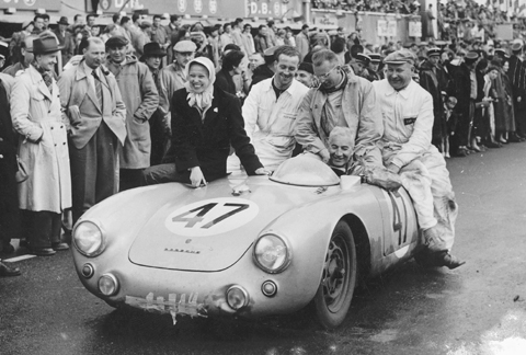 Zora’s wife Elfi joins Zora and crew in celebrating 1954 class win at Le Mans in a Porsche 550.