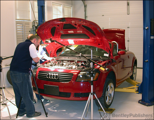 Bentley technical editors working on a TT Roadster.(BentleyPublishers.com watermark not printed on actual product.)