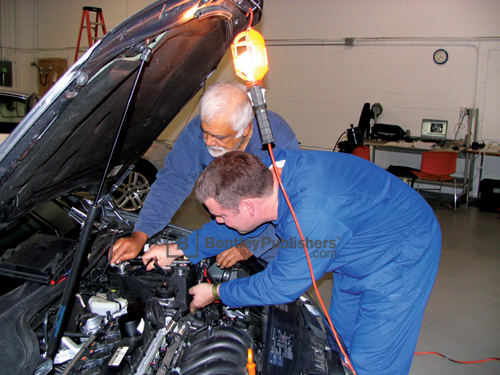 Bentley technical editors working on a 2005 Jetta.